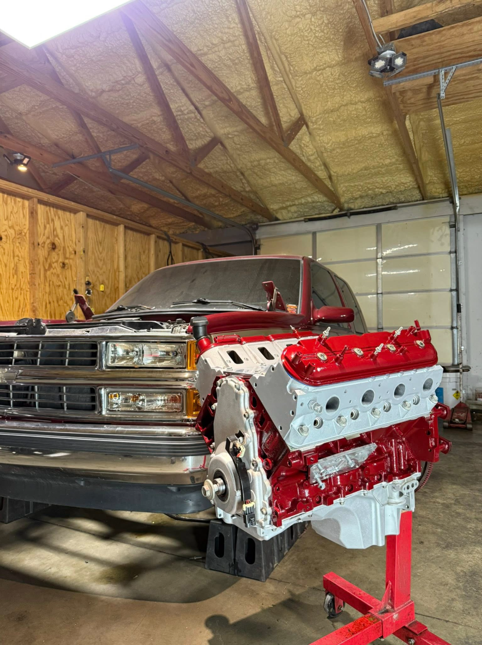 Freshly painted LS long block on an engine stand